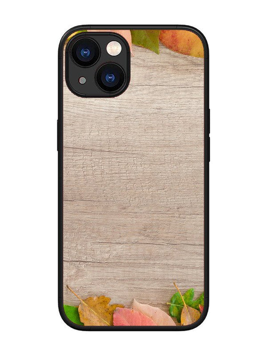 iPhone 13 Autumn Leafs On Wooden Table