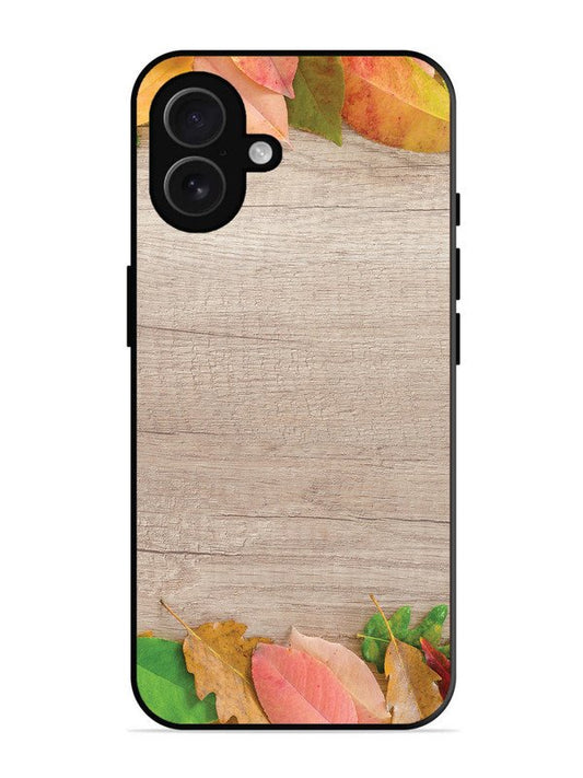iPhone 16 Plus Autumn Leafs On Wooden Table
